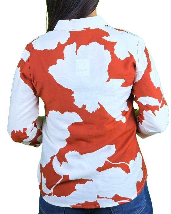 women white with orange print shirt trooking